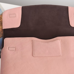 Open White Rose leather laptop sleeve showing soft suede lining, interior card pocket, magnetic corners—minimalist laptop case.