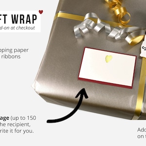 Gift wrap option – gold and silver ribbon, protective paper, handwritten gift card and bear tag for leather handbag gifts.