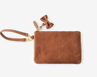 OOPSIE - Leather wristlet clutch with bow tie - BEAUTY IMPERFECTIONS