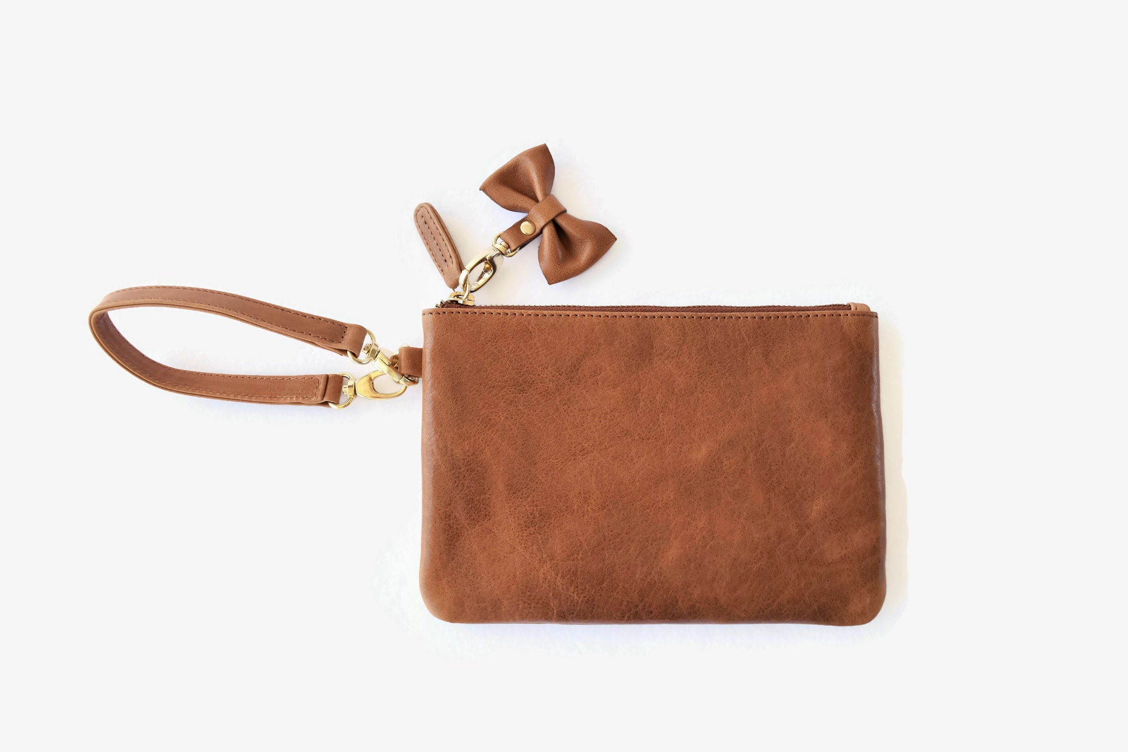 OOPSIE - Leather wristlet clutch with bow tie - BEAUTY IMPERFECTIONS