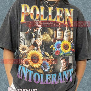 May include: A white ceramic mug with a black handle and the text "But First, Coffee" in a black, handwritten-style font. The mug is on a white surface.