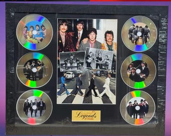 Conjunto de discos de presentación con imágenes enmarcadas de THE BEATLES MEMORABILIA, leyendas de la música, stock en el Reino Unido