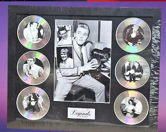 May include: Framed black and white photo collage featuring a central image of a man holding records, surrounded by smaller photos and CD-like discs. The text "Legends of music" is visible. The top banner reads "High Quality" and the bottom banner reads "Fast & Free Delivery".