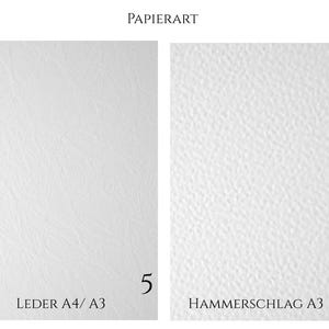 May include: Two white paper sheets labeled PAPIERART. The left sheet, labeled 5 and LEDER A4/ A3, has a smooth, subtle leather-like texture. The right sheet, labeled 6 and HAMMERSCHLAG A3, features a distinct, bumpy, hammered surface texture.