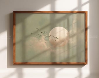 May include: A framed art print featuring a serene landscape. The artwork depicts a large, pale sun, soft clouds, and a flock of birds in flight against a muted green and peach background. The wooden frame adds a classic touch.