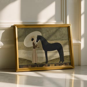 May include: Framed art print depicting a woman with a parasol and a black horse. The artwork is in a gold frame, with a muted colour palette of greens, browns, and creams. The image is a stylized illustration with a vintage aesthetic.