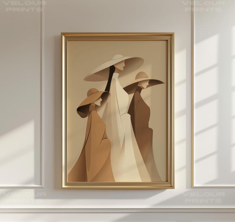 May include: A framed art print featuring three stylized figures wearing wide-brimmed hats and long coats. The figures are rendered in shades of beige, brown, and white, creating a minimalist and elegant aesthetic. The artwork is framed in a gold-colored frame.