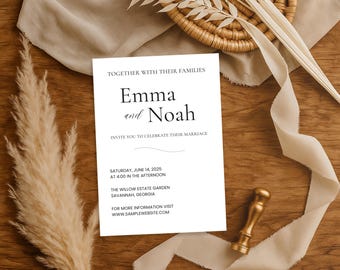 May include: A white wedding invitation with the names "Emma and Noah" printed in black. The invitation includes the date, time, and location of the wedding. A gold wax seal and decorative elements are arranged on a wooden surface.