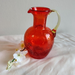 May include: A set of three ceramic mugs with a speckled, matte finish. The mugs are in shades of cream, light gray, and dark gray. Each mug has a simple, minimalist design, perfect for coffee or tea.