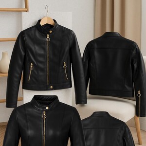 May include: Black faux leather jacket with a stand-up collar and gold-tone zipper and hardware. The jacket has a classic biker style with a tailored fit. The design includes zippered pockets and a button closure at the collar and waist. The jacket is displayed from multiple angles.