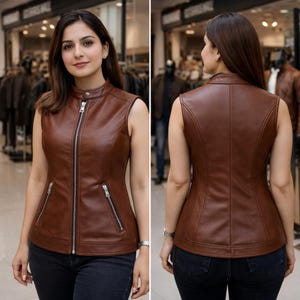 Pu&ograve; includere: Un gilet in pelle marrone con collo alto e chiusura con cerniera argentata. Il gilet ha due tasche con cerniera e una vestibilit&agrave; su misura. L'immagine mostra la parte anteriore e posteriore del gilet.