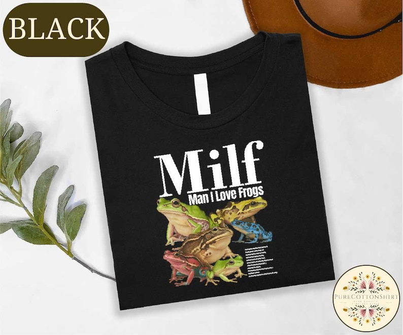 a black t-shirt with a graphic design of a group of colorful frogs.