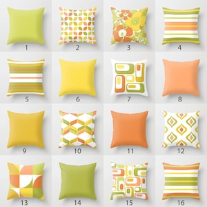 May include: Sixteen different pillow designs with geometric patterns in shades of yellow, green, orange, and white. The pillows are arranged in a grid pattern.