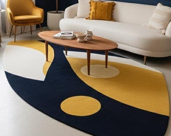 Alfombra ovalada abstracta moderna en negro y mostaza con diseño geométrico para sala de estar y dormitorio.