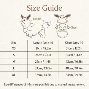 May include: A size guide chart for pet clothing featuring a line drawing of a character with pointed ears. The table lists sizes XS through XL with corresponding length and chest measurements in both centimeters and inches. A small pumpkin illustration is at the bottom right.