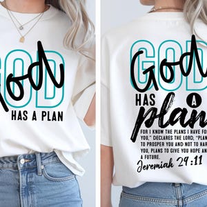 May include: A white short-sleeve t-shirt featuring the text GOD HAS A PLAN in teal and black on the front. The back displays the same text with the additional verse: FOR I KNOW THE PLANS I HAVE FOR YOU, DECLARES THE LORD, PLANS TO PROSPER YOU AND NOT TO HARM YOU, PLANS TO GIVE YOU HOPE AND A FUTURE. JEREMIAH 29:11.