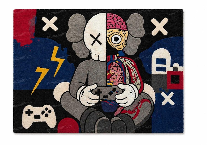 May include: A rectangular rug featuring a cartoon character design. The character is split, with one side showing a skull and the other side revealing internal organs. The character is holding a video game controller. The rug has a black background with white X's and a yellow lightning bolt.