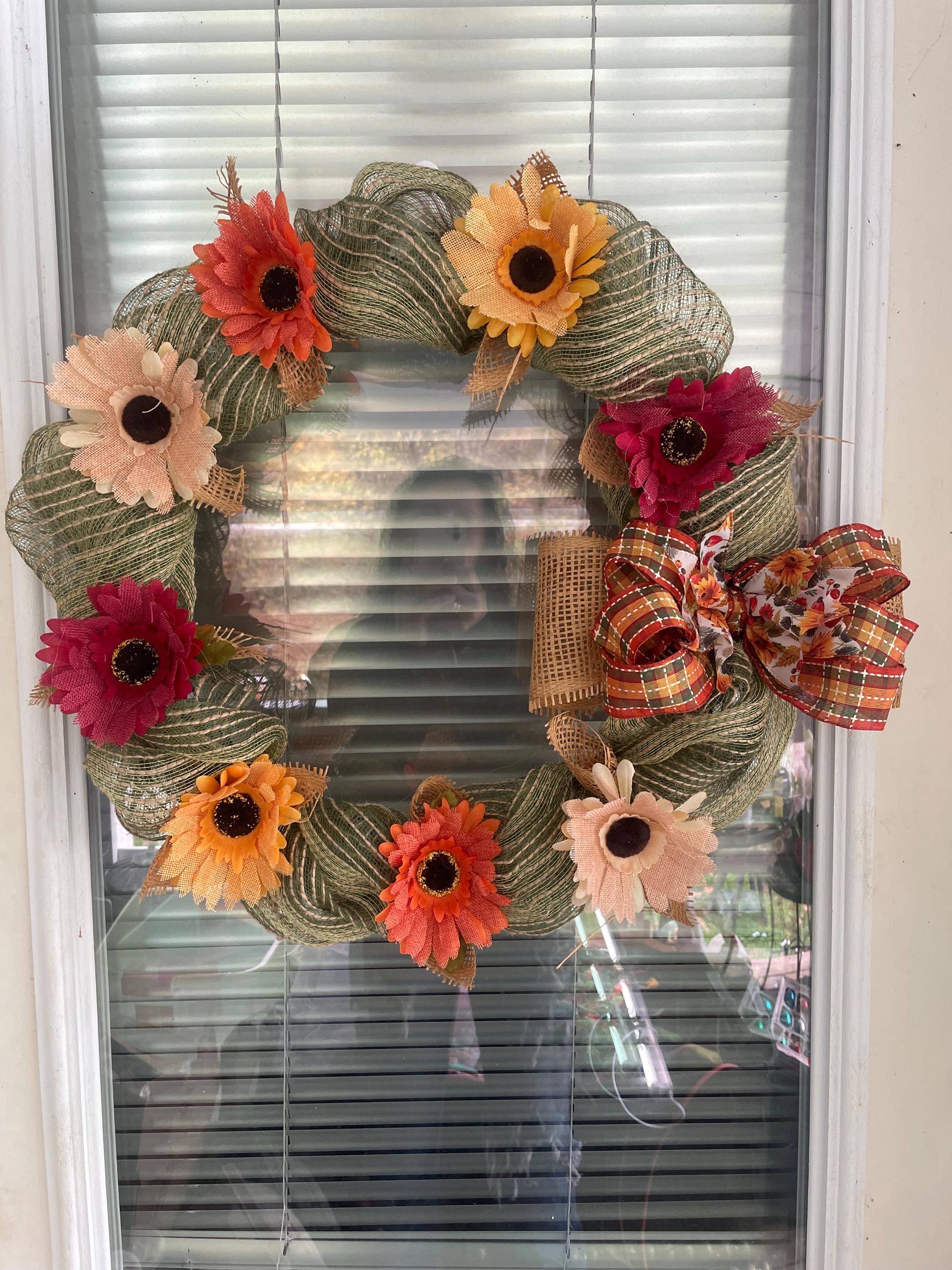 green burlap wreath with burlap flowers