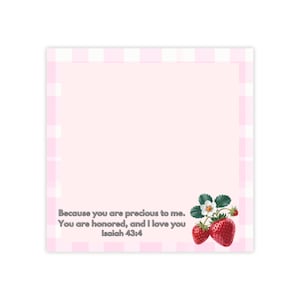 May include: A pink notepad with a gingham border and the text "Because you are precious to me. You are honoured, and I love you Isaiah 43:4." Features a watercolour illustration of strawberries with green leaves.