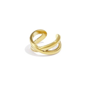May include: A gold ear cuff featuring a double-banded, crisscross design. The jewellery is displayed against a white backdrop, emphasising its smooth, reflective surface. This ear cuff is a contemporary accessory.