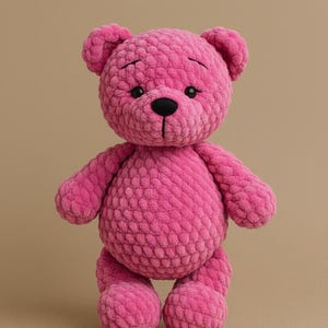 May include: A handmade, plush pink teddy bear with a textured surface. The bear has a round body, small arms and legs, and a black nose and eyes. The bear is standing upright against a neutral background.