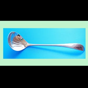 May include: A set of three ceramic vases in varying heights. The vases are white with a textured, ridged design. The tallest vase is approximately 10 inches tall, the medium vase is 8 inches, and the smallest is 6 inches.