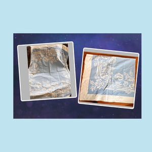 May include: Two images of a light blue tablecloth with a white floral pattern. The tablecloths are rectangular and feature a repeating design of flowers and foliage. The edges are bordered with a white trim.