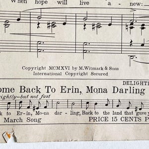 May include: A vintage sheet music cover for the song "Come Back To Erin, Mona Darling" by Dave Reed. The cover features a black and white illustration of musical notes and a title card with the song title and composer's name.