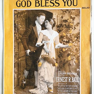 May include: A vintage sheet music cover featuring a couple in a garden setting. The cover is yellow with black text that reads "Good-Bye, Good Luck, God Bless You." The text "BALLAD" is in the upper right corner. The music is by Ernest R. Ball and the words are by J. Keirn Brennan. The sheet music is published by M. Witmark & Sons, New York, Chicago, London.