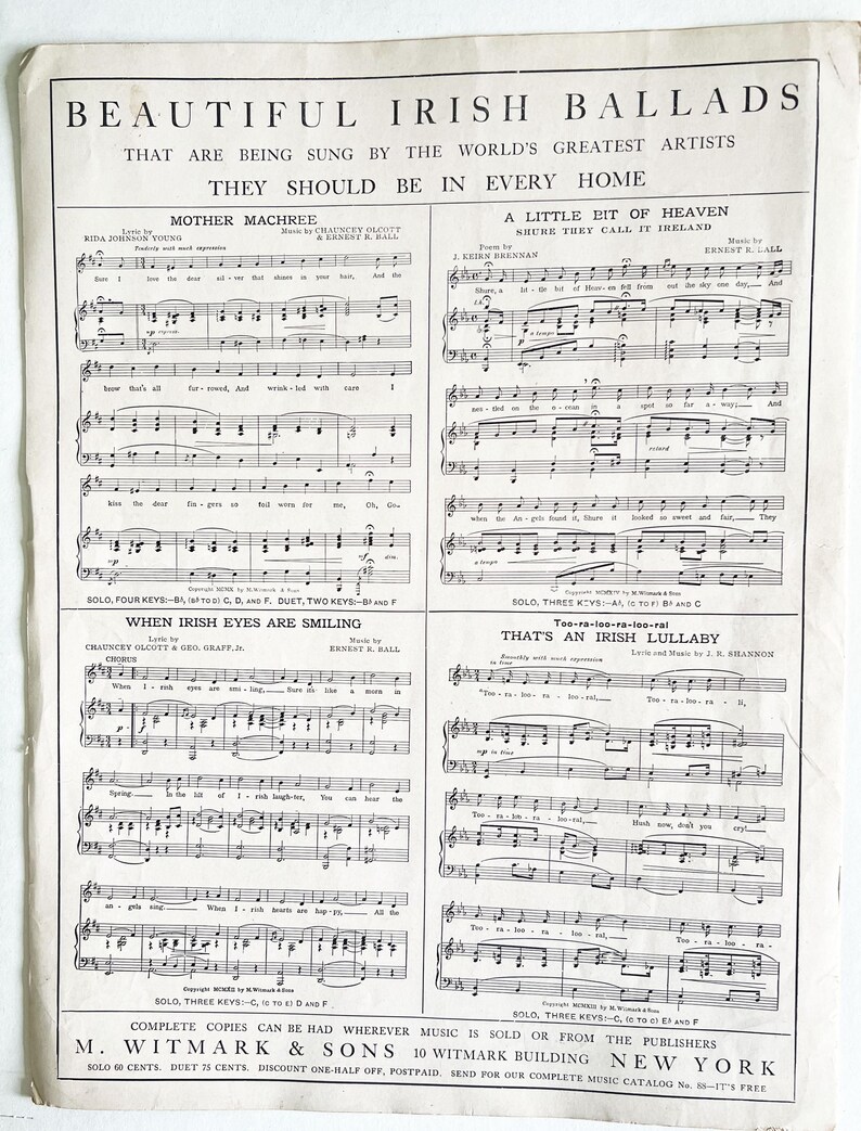 May include: A vintage sheet music book with a black and white cover featuring the title "Beautiful Irish Ballads". The cover also includes the text "That are being sung by the world's greatest artists. They should be in every home." The sheet music includes four songs: "Mother Machree", "A Little Bit of Heaven", "When Irish Eyes Are Smiling", and "That's an Irish Lullaby".