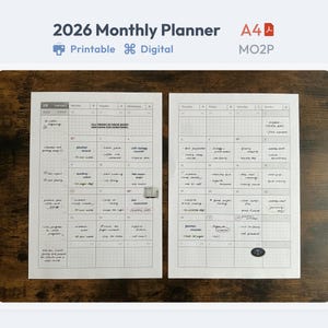May include: A 2026 monthly planner with a white background, featuring a two-page spread with calendar grids and handwritten notes. The planner is labeled "Printable" and "Digital". The A4 size planner is on a dark wood surface.