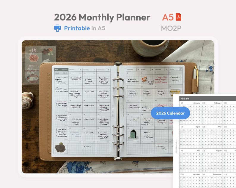 May include: A 2026 monthly planner in A5 size with a tan binder cover. The open planner displays a grid layout with handwritten notes and small stickers. A separate 2026 calendar sheet is visible in the corner. The text reads 2026 Monthly Planner, A5, MO2P, and 2026 Calendar.