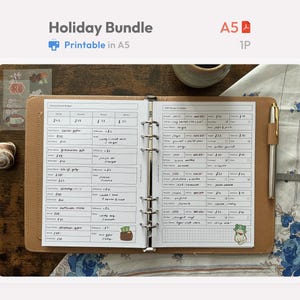 May include: An A5 printable holiday bundle planner insert featuring a seasonal event budget and gift planner tracker. The white paper has black printed grids and handwritten notes, held in a tan leather binder with a silver metal pen attached.