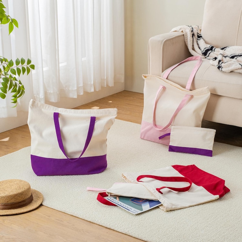 a cozy living room with a beige sofa, a rug, and various bags and accessories scattered on the floor.