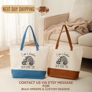 two tote bags with a humorous text printed on them, placed on a rug in front of a couch.