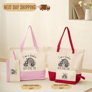 a set of three bags and a small bag, all with the same design and text, indicating they are part of a matching set.