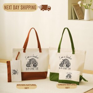 a set of three tote bags with a humorous message printed on them. The bags are arranged on a white surface, with one being larger and two smaller ones. The larger bag is brown, and the smaller bag is green. The message on the bags reads "I am a hoser on my spare time".