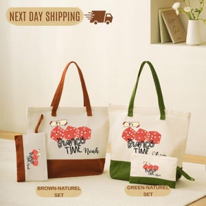 a collection of bags and accessories, including a tote bag, a small bag, and a wallet, all with the text "Bunco Time Noah" printed on them. The bags are displayed on a white surface, and there is a sign indicating "Next Day Shipping" above the bags.