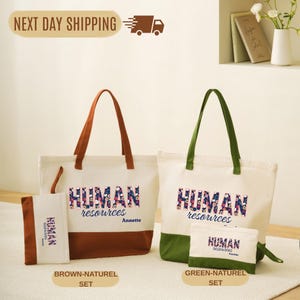 May include: Two canvas tote bags and matching pouches. One set is brown and natural, the other green and natural. Each bag and pouch has "HUMAN resources" printed in a floral design. The brown set has "Annette" printed below the text.