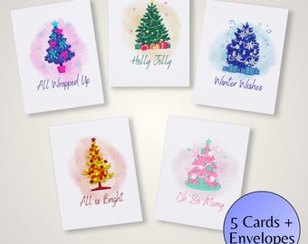 May include: Set of five Christmas greeting cards with watercolor illustrations of decorated Christmas trees. Each card features a different tree design and a festive message, including "All Wrapped Up" and "Winter Wishes". Includes envelopes.