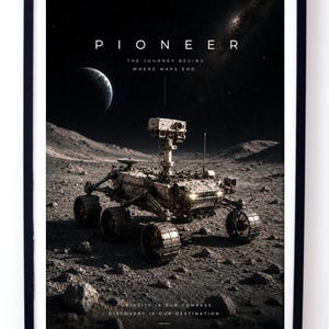 May include: A framed poster featuring a space rover on a rocky lunar surface. The text reads PIONEER THE JOURNEY BEGINS WHERE MAPS END and CURIOSITY IS OUR COMPASS. DISCOVERY IS OUR DESTINATION. A crescent planet and starry sky are visible in the background.