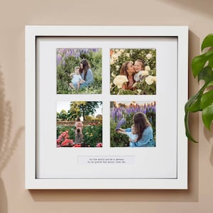 May include: A white picture frame with four photos of a mother and child in a field of flowers. The text "To the world you're a person, to us you're the world. Love Dad." is printed below the photos.