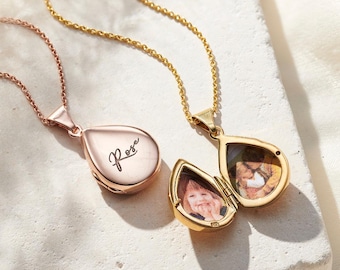 May include: Two gold teardrop-shaped lockets on chains. One locket is open and shows a photo inside. The other locket is closed and has the word "Rose" engraved on the front.