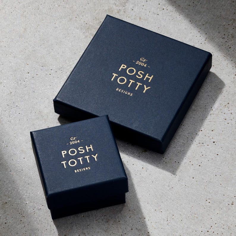 May include: Two navy blue boxes with gold lettering. The larger box says "Est. 2004 - Posh Totty Designs". The smaller box says "Est. 2004 - Posh Totty Designs".