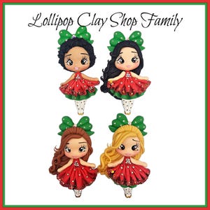 May include: Four clay figurines of girls with different hair colors and skin tones. Each girl wears a red dress with white polka dots, green bow, and white and green patterned stockings. The text "Lollipop Clay Shop Family" is at the top.