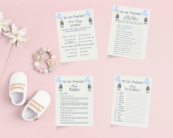 May include: A collection of baby shower games and accessories on a pink background. The games include "Would Mommy Rather?", "Who Knows Mommy Best", "Baby Wishes", and "Baby Scramble". Also shown are white baby shoes, a wooden bird rattle, and decorative paper flowers.