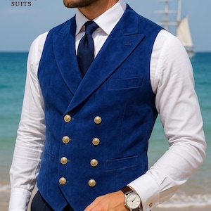 May include: A double-breasted, royal blue vest with gold buttons. The vest is worn over a white dress shirt and dark tie. The image includes the text "MENFINITY SUITS" in the upper left corner. A watch with a brown leather band is visible.