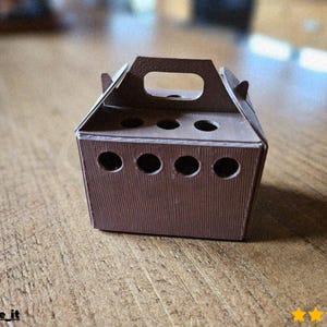 May include: A brown cardboard gift box with a handle and several circular openings. The box has a textured, vertical-lined pattern and is sitting on a wooden surface. The box has five circular openings on the front.