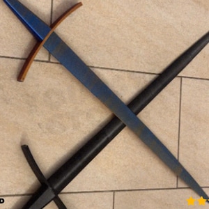 May include: A blue and brown sword with a black scabbard is crossed over another sword. The sword has a blue blade and a brown crossguard. The scabbard is black. The background is a light brown tile.