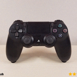 May include: A black PlayStation 4 controller with a textured finish. It has a directional pad, two analogue sticks, and buttons with coloured symbols. The controller includes a central touchpad and the PlayStation logo.